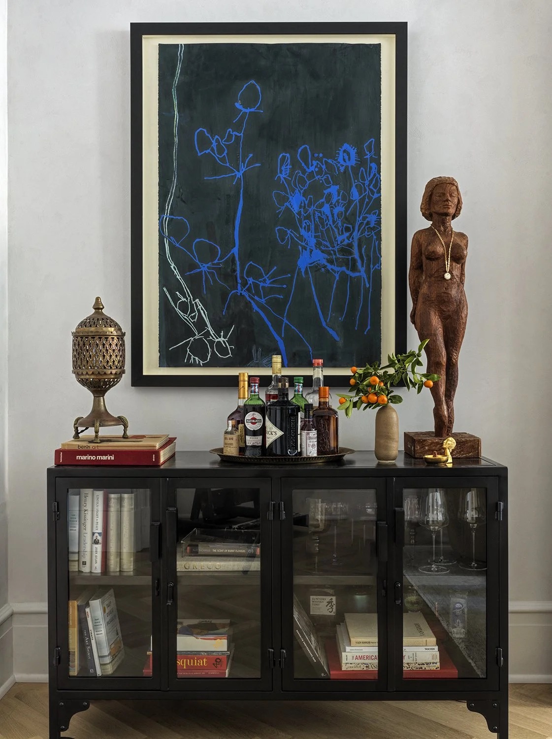 A lounge detail mixing vintage and custom furnishings