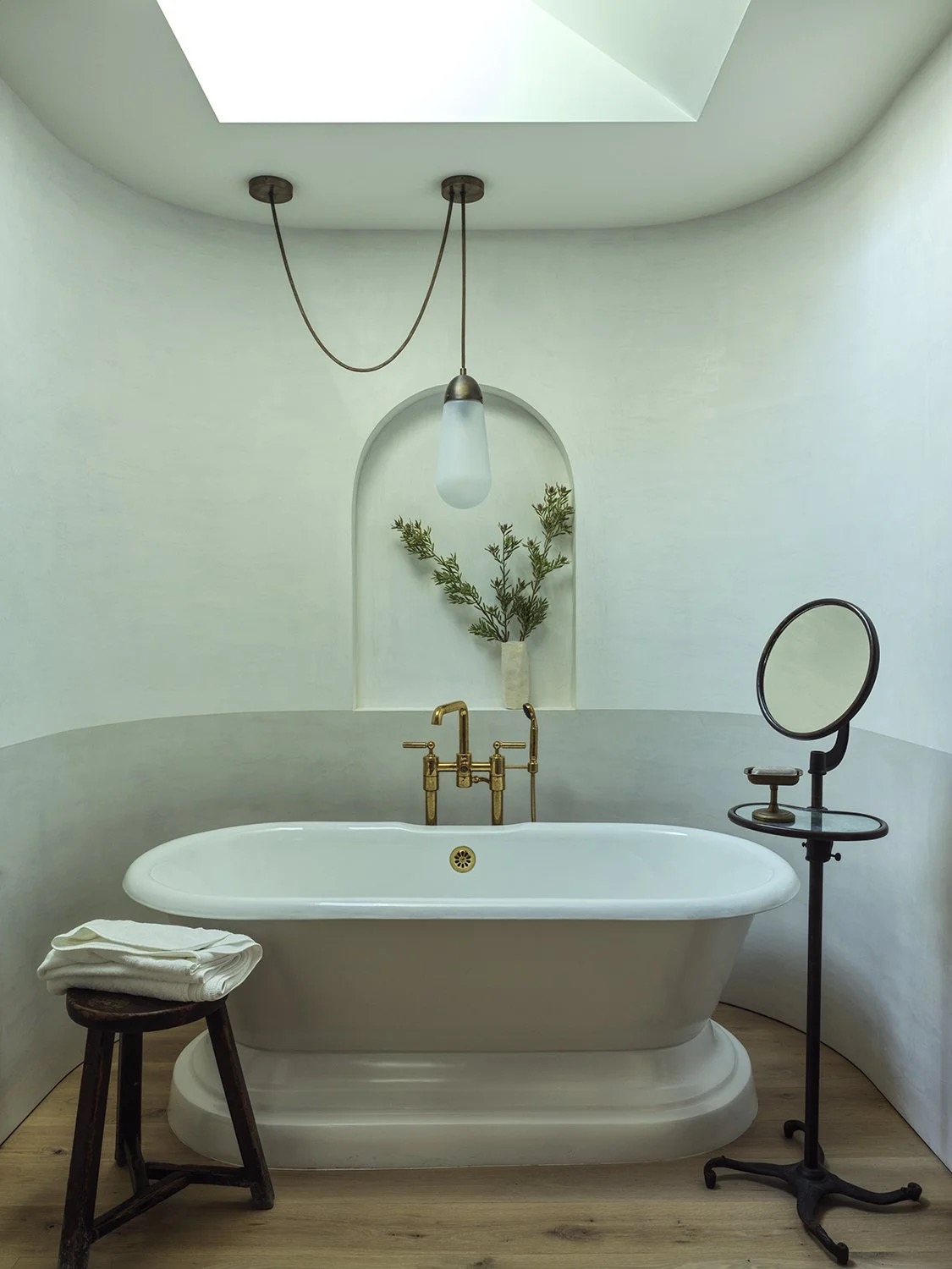 A timeless bathroom with warm fixtures and characterful detailing by Hallie Goodman
