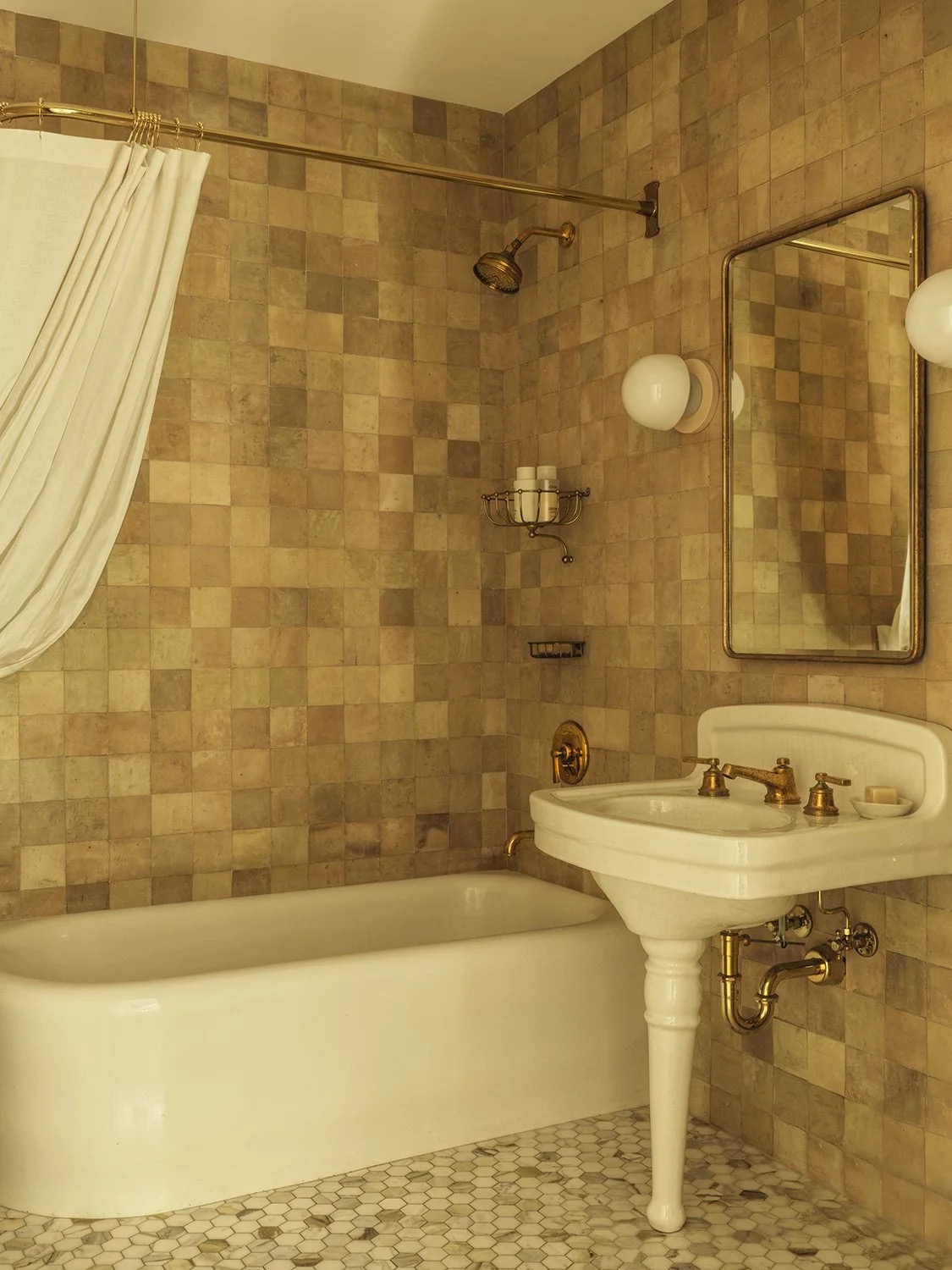 A warm, timeless bathroom with considered fixtures
