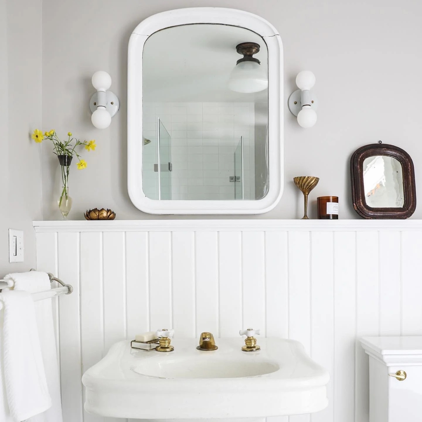 A bathroom with warm, collected character