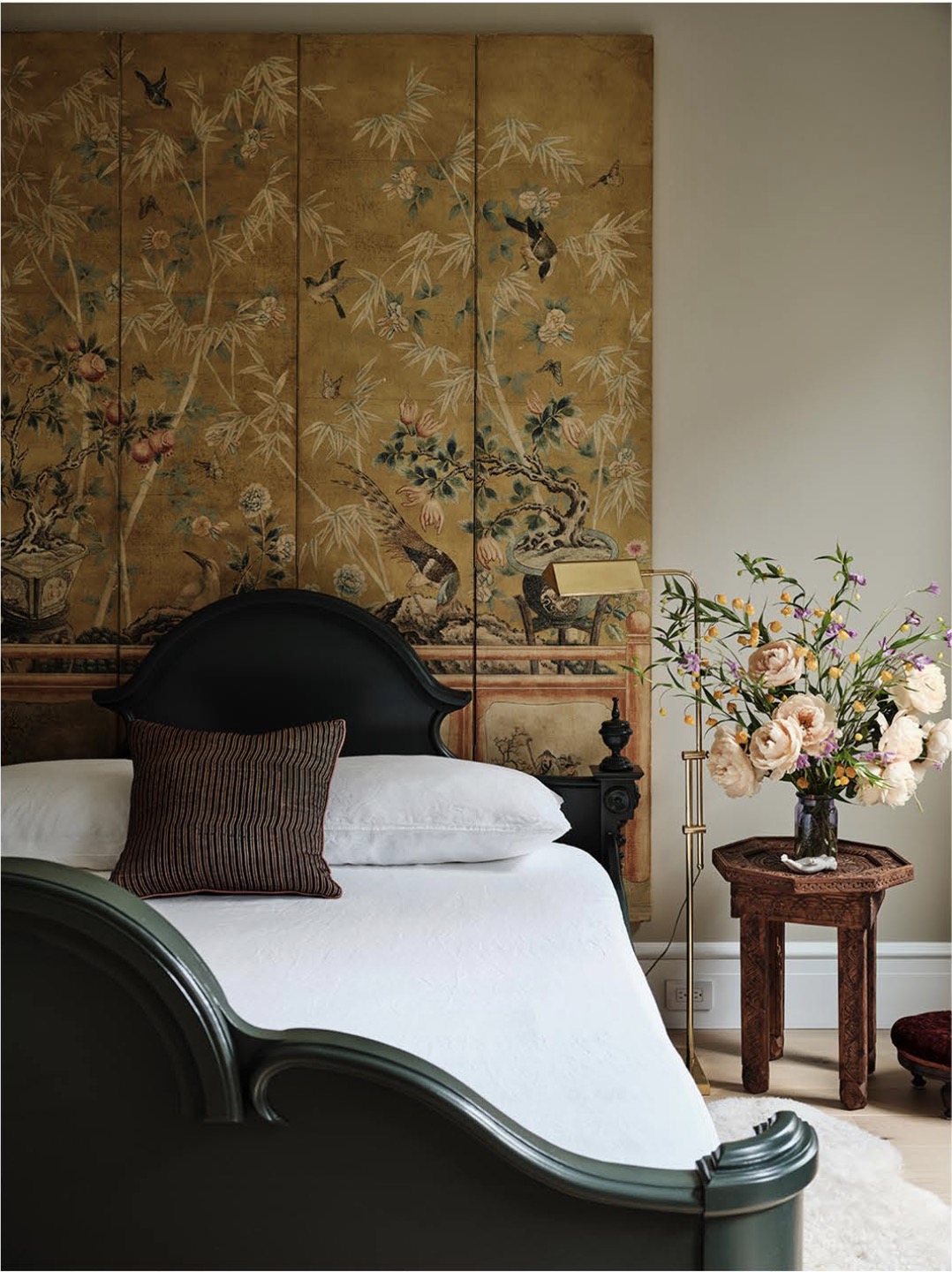 A layered bedroom with atmospheric light and color