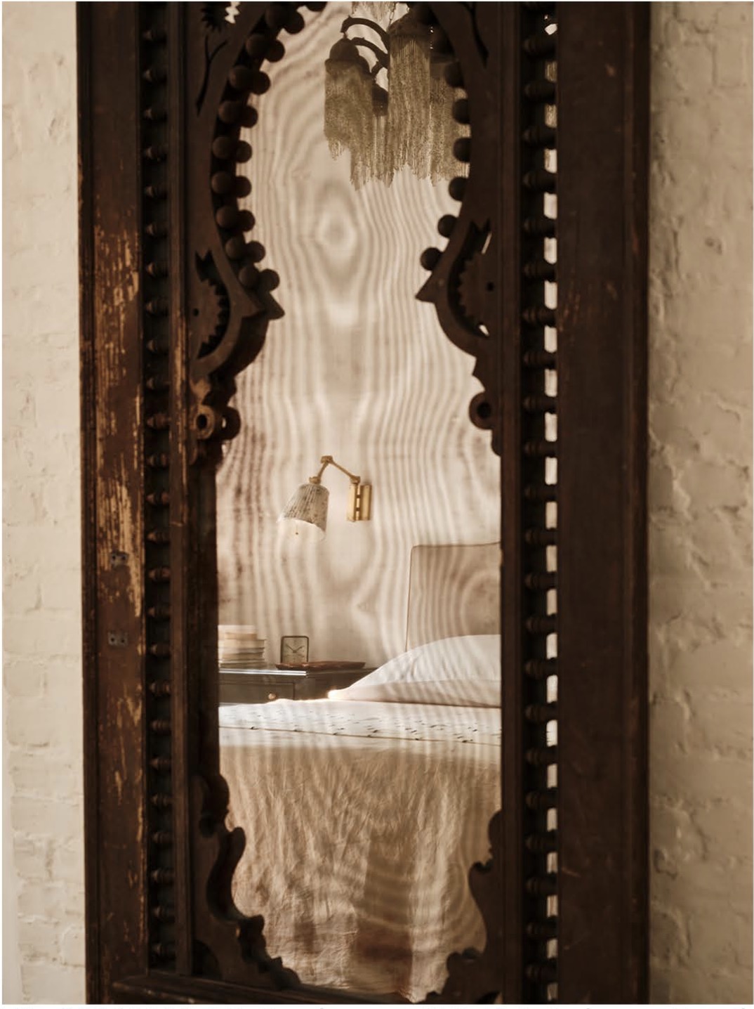 A serene bedroom vignette with sumptuous materials