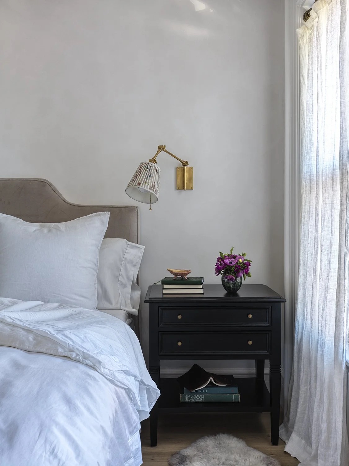 A bedroom layered with light and color by Hallie Goodman
