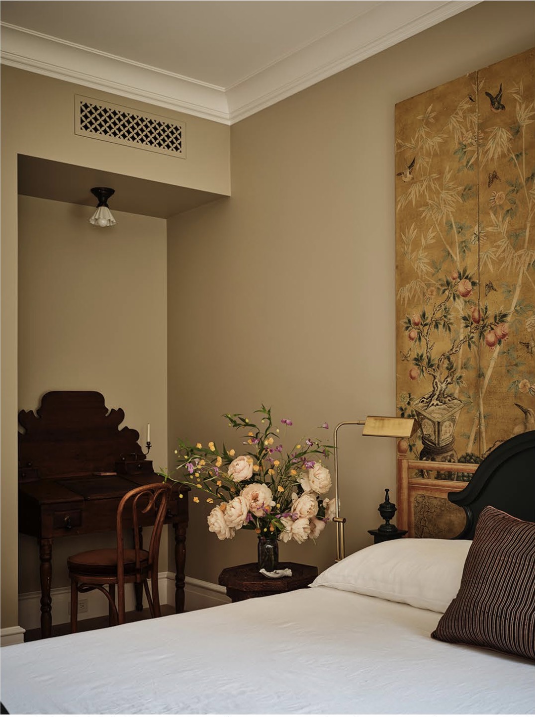 An atmospheric bedroom styled with florals