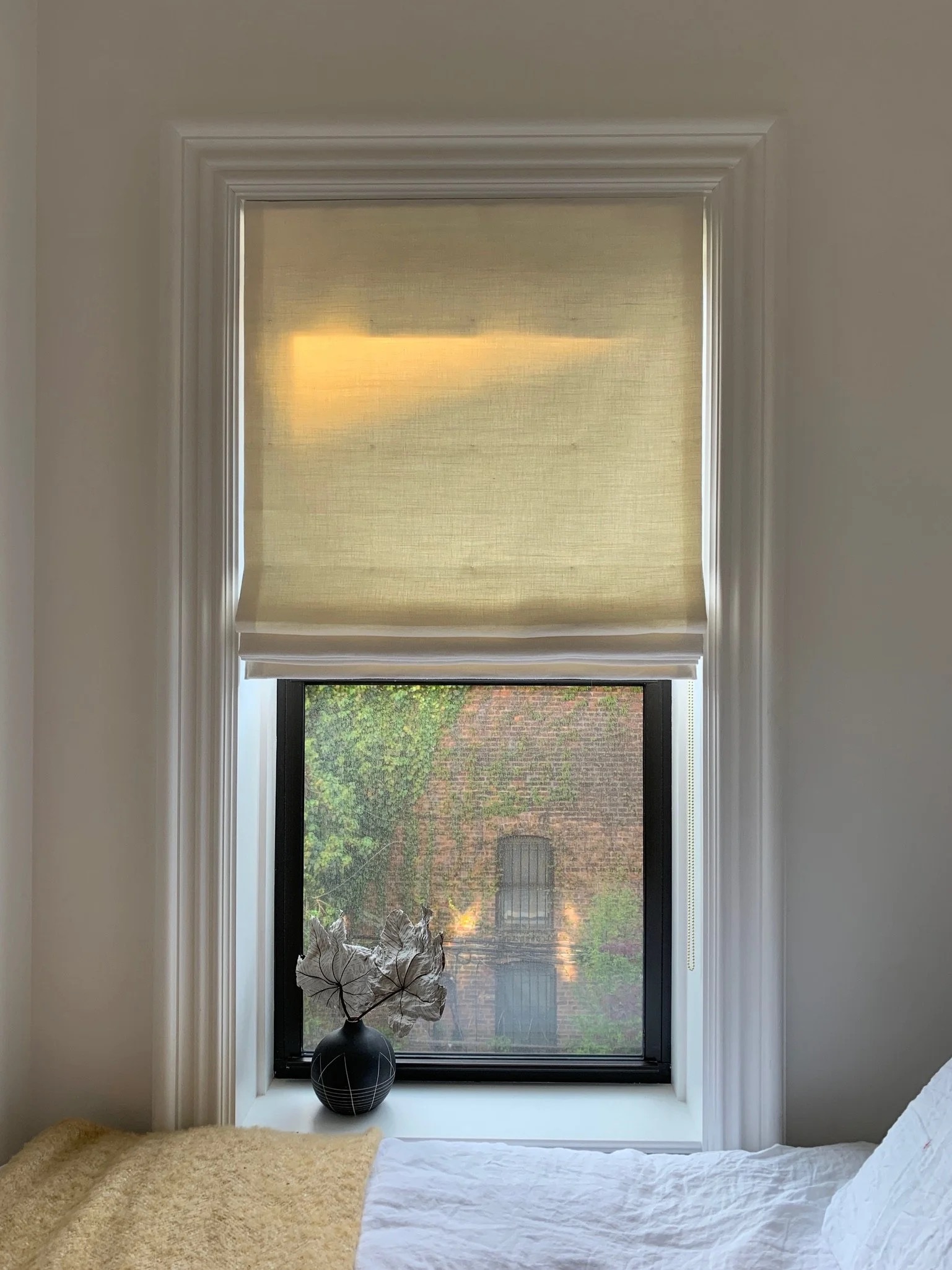 A tactile bedroom detail photographed by Hallie Goodman